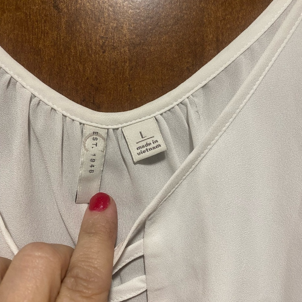 White sheer top with cute tie at bottom.